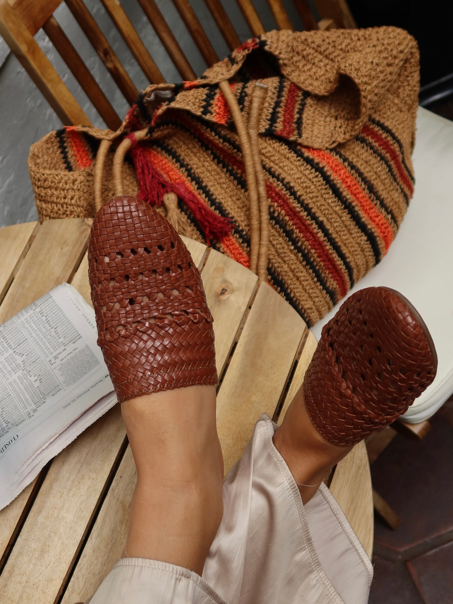 woman wearing handwoven leather mule sandal in mustard yellow